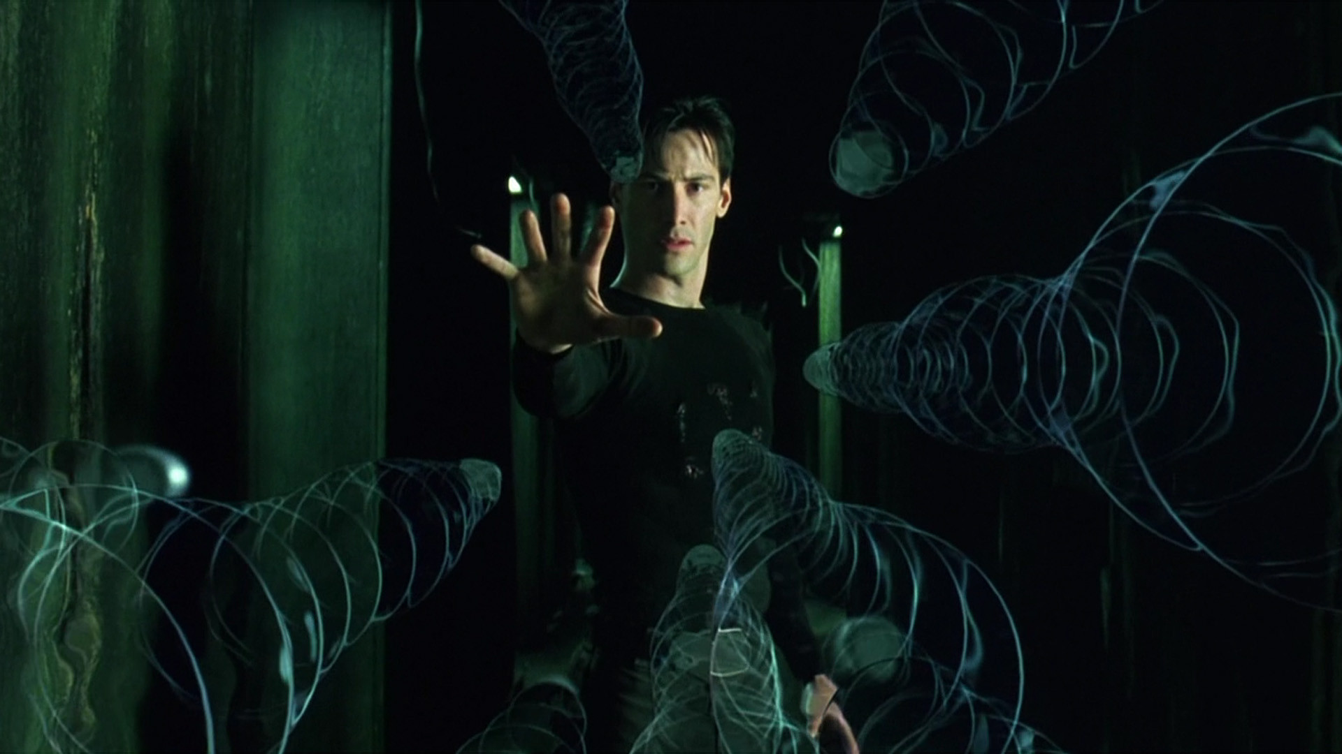 Snímek z filmu Matrix. Vyvolený zastavuje letící kulky silou mysli. (Warner Bros. Entertainment)